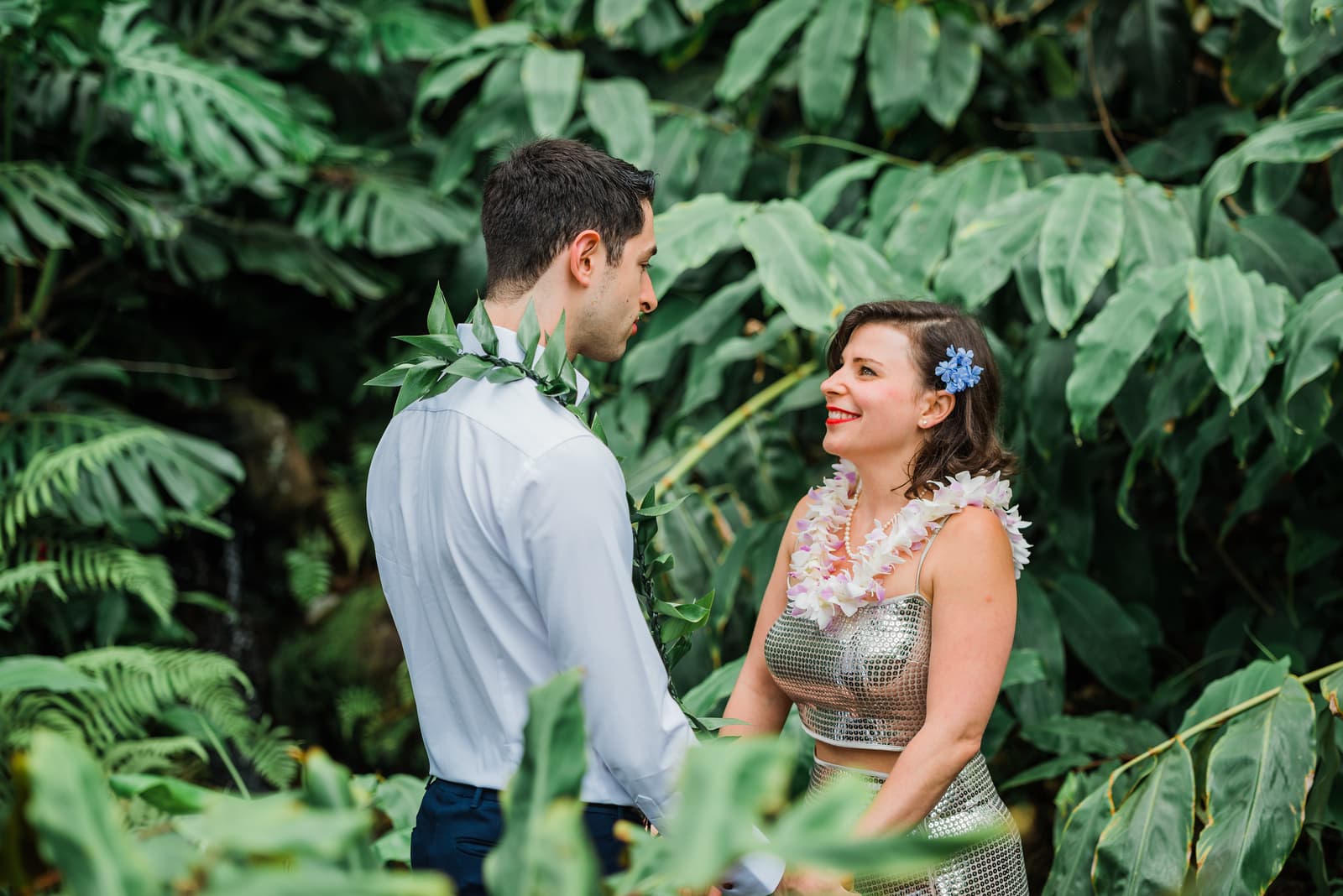 A bride and groom during their elopement ceremony at Kula Botanical Garden in Hawaii